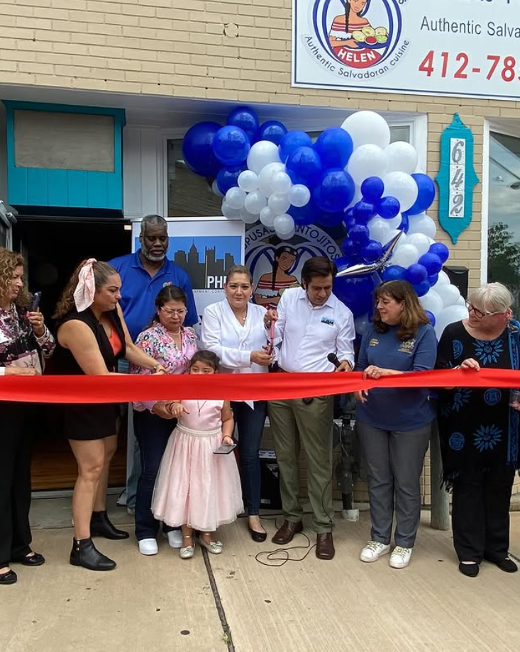 Blanca Martinez Pupusas y Antojitos Helen Cutting the Ribbon Opening Day